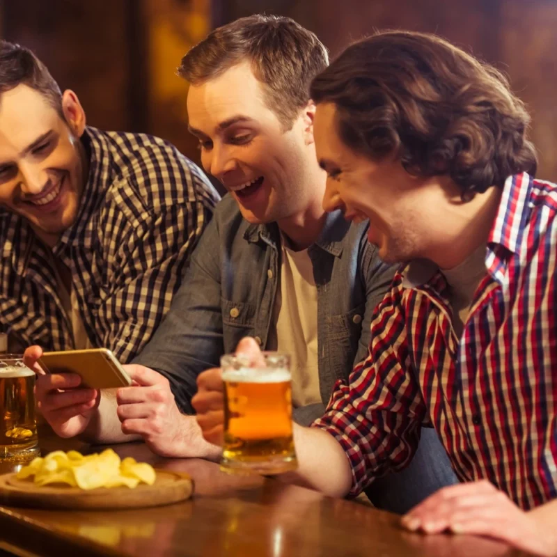 Group of friends in an irish pub after a golf match.
