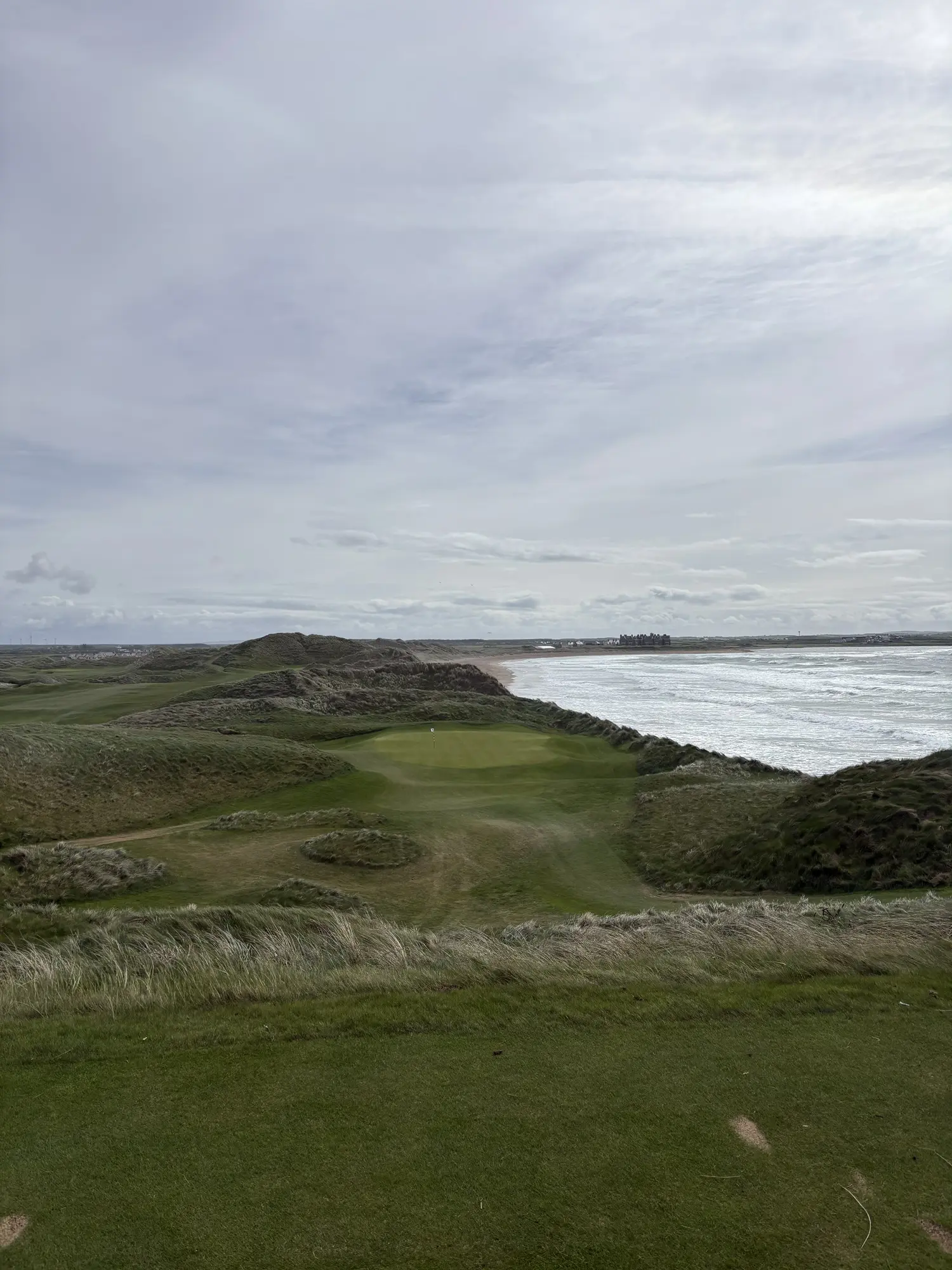 The famous 14th hole at Doonbeg, a short par 3 with one of the finest coastal backdrops in Irish golf.